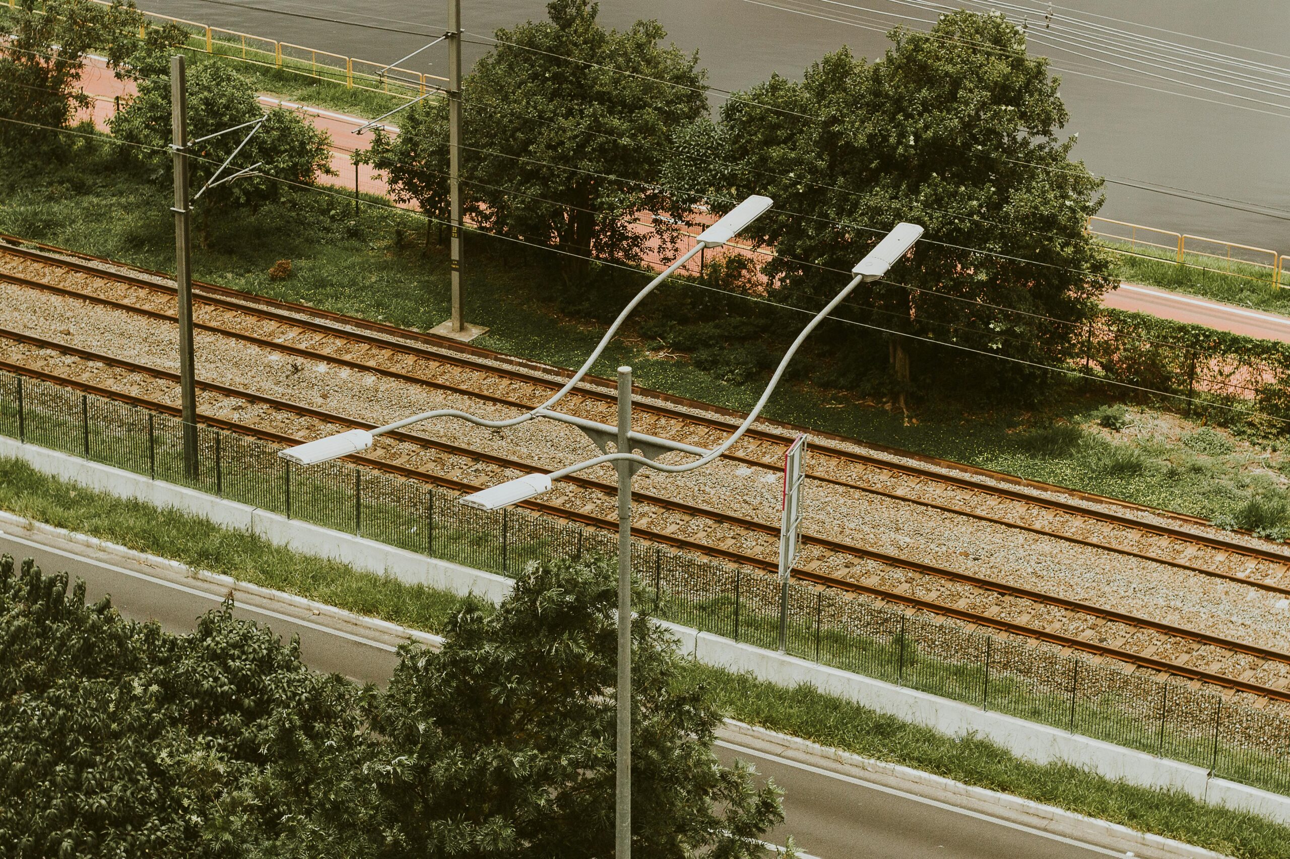 Street lights and train tracks in São Paulo, Brazil, captured from above.